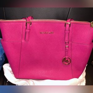 Pink Michael Kors tote.